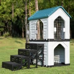 Playhouse for cats with stairs, outdoor pet shelter, multi-level cat house with safety gate, durable plastic and metal design, perfect for outdoor gardens or yards.