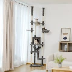 Luxury cat tree with multiple platforms, hideouts, and cozy beds, featured in a modern living room, ideal for pet owners seeking stylish and functional furniture for their cats.