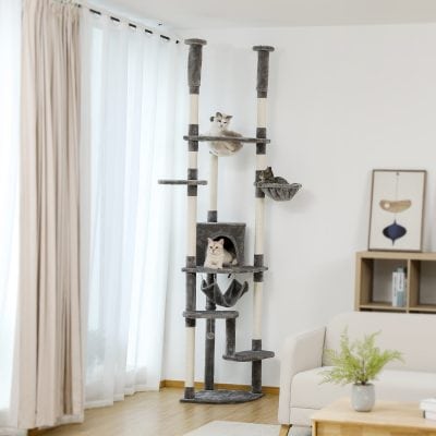 Luxury cat tree with multiple platforms, hideouts, and cozy beds, featured in a modern living room, ideal for pet owners seeking stylish and functional furniture for their cats.