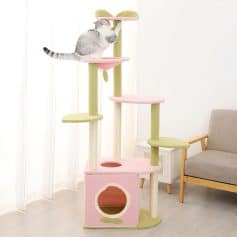 Fluffy cat climbing pastel-colored cat tree at Monalisa Store, pet furniture, modern cat scratching post with multiple levels and cozy hideouts for cats, stylish pet accessories accessory for cat lovers.