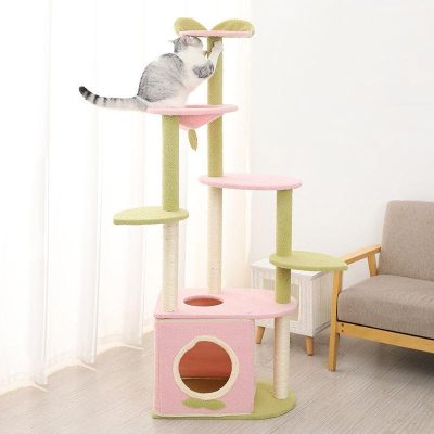 Fluffy cat climbing pastel-colored cat tree at Monalisa Store, pet furniture, modern cat scratching post with multiple levels and cozy hideouts for cats, stylish pet accessories accessory for cat lovers.