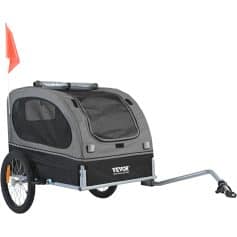 Light gray bike cargo trailer with black mesh windows, suitable for transporting pets or goods, featuring durable wheels and a connecting hitch for secure attachment.