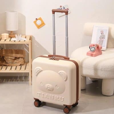 Cute bear design travel suitcase with telescopic handle and wheels, ideal for kids’ travel, featuring a soft pastel color, perfect for family trips and travel accessories for children.
