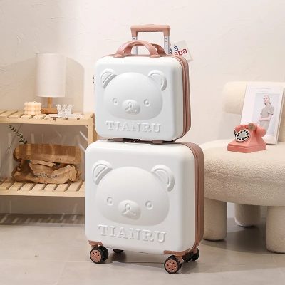 Cute bear suitcase with wheels and pink handle, perfect for children and travel, displayed in a stylish room decor setup.