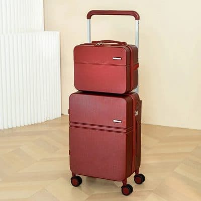 Spacious red luggage set with an attached carry-on and large suitcase, ideal for travel comfort and style.