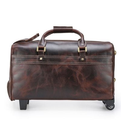 Leather travel bag with wheels and sturdy handles, perfect for business trips and weekend getaways. Stylish, durable, and spacious travel accessories for frequent flyers.