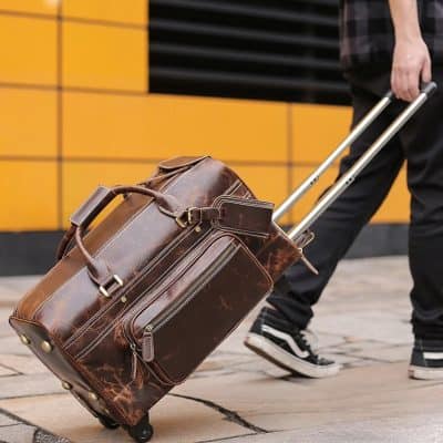 Exotic leather travel bag with wheels and multiple compartments, perfect for business trips and vacations. Durable and stylish luggage for modern travelers.