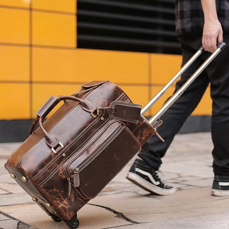 Exotic leather travel bag with wheels and multiple compartments, perfect for business trips and vacations. Durable and stylish luggage for modern travelers.
