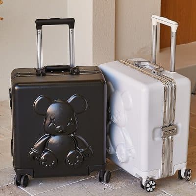 Black carry-on luggage with teddy bear design, suitable for travel and kids' accessories.