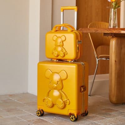 Yellow teddy bear themed luggage set for children, fun and stylish travel accessories, perfect for kids' travel needs, vibrant design, durable with wheels, suitable for young travelers.
