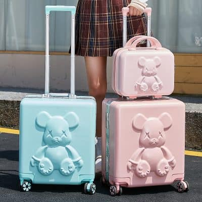 Blue teddy bear hard-shell suitcase with wheels, part of Monalisa Store's travel accessories collection.