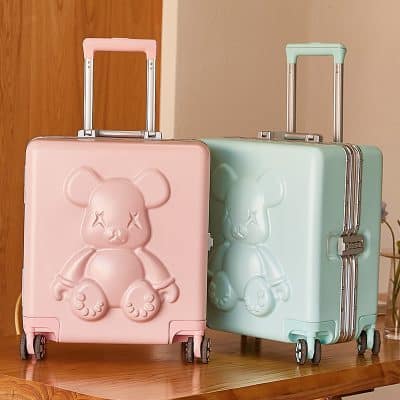 Pink teddy bear shaped suitcase, pastel pink and mint green travel luggage, Monalisa Store unique designer suitcases, stylish and durable carry-on bags for kids and teens, trendy travel accessories for kids, fun kids' travel gear, modern and cute luggage for children.