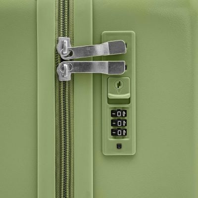Secure green luggage with combination lock and tamper-proof zippers for safe travel.