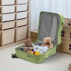 Suitcase filled with toys and children's clothing, used as a playful storage solution for kids' belongings in a nursery or playroom.