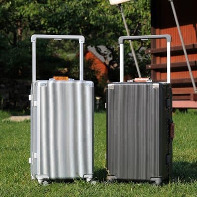 Aluminum suitcases with telescopic handles for travel and luggage storage at Monalisa Store.
