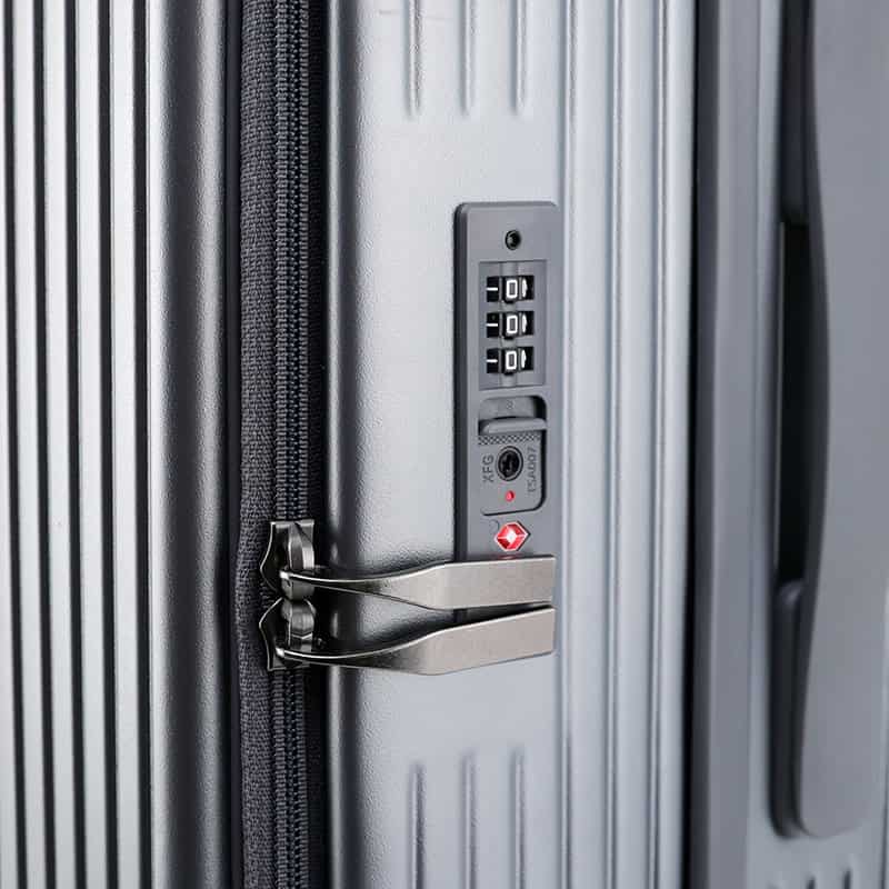 Kiosk lock on silver vertical emergency exit door with keypad lock for security and safety.