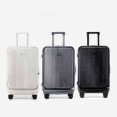 White, gray, and black hard-shell rolling suitcases with telescopic handles and spinner wheels, designed for travel and luggage storage.