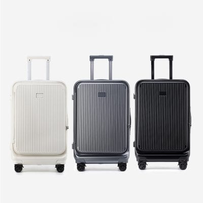 White, gray, and black hard-shell rolling suitcases with telescopic handles and spinner wheels, designed for travel and luggage storage.