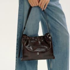 Elegant dark brown leather handbag with adjustable strap, stylish accessory for women, perfect for casual and formal outfits, available at Monalisa Store.