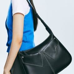 Elegant black designer handbag with contrasting white stitching, perfect for fashion-forward women, showcased at Monalisa Store, ideal for accessories and luxury eyewear shopping.