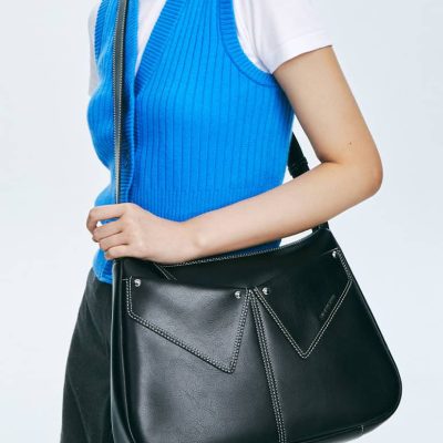 High-quality black leather tote bag with unique stitching design, perfect for fashion-forward women on the go. Stylish and spacious for everyday use, elegance, and practicality.