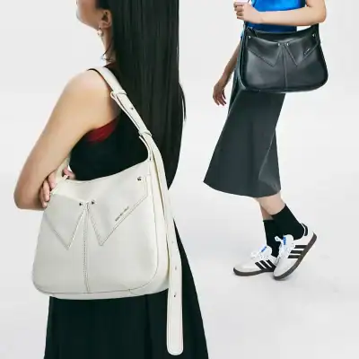 Stylish women with Monalisa store designer handbags showcasing luxury fashion accessories for women.