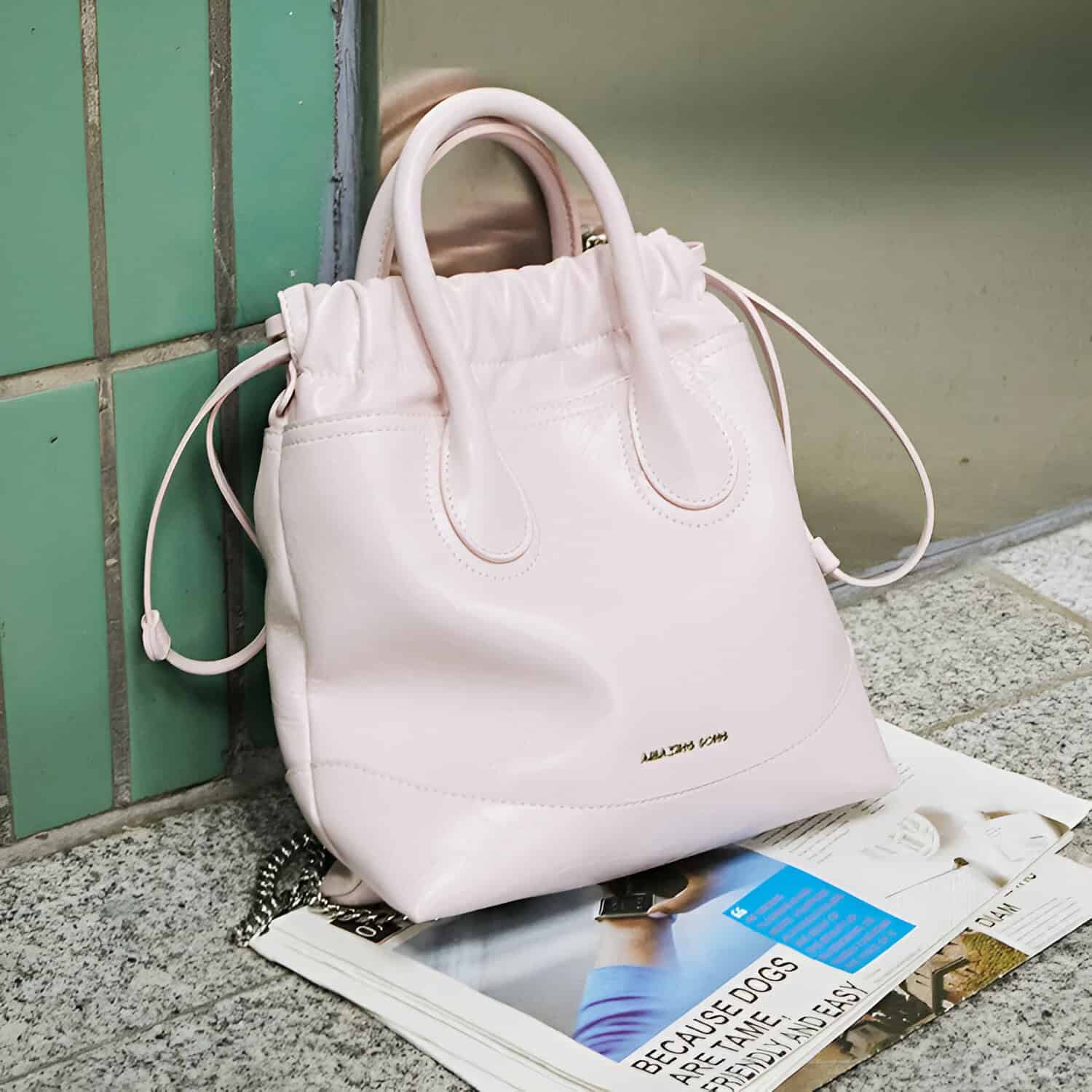 Leather handbag on city street, stylish accessory, Monalisa Store, trendy fashion, elegant women's purse.