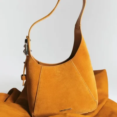 Stylish mustard yellow handbag with contemporary design, perfect for fashion-forward occasions and daily use.