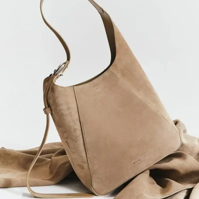Soft beige designer handbag with sleek minimalist style, perfect for fashion-conscious women and daily use. Made with quality materials for a chic and practical accessory.