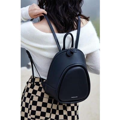 Stylish black mini backpack with top handle and adjustable straps, perfect for everyday use and travel, from Monalisa Store.