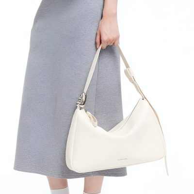 Luxurious white leather shoulder bag with sleek design, perfect for stylish women seeking elegant accessories. Features adjustable strap and spacious interior.