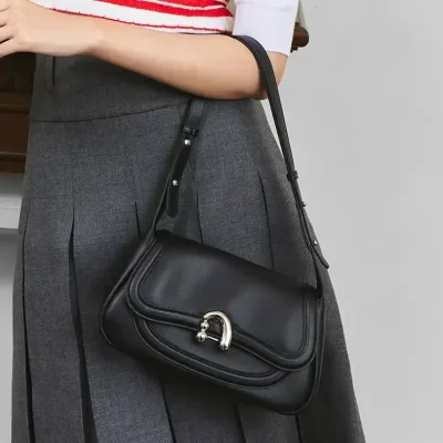 Elegant black leather shoulder bag with silver hardware, perfect for stylish professional or casual outfits, available at Monalisa Medical Store.