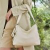 Luxurious ivory leather handbag with adjustable shoulder strap, perfect for stylish women. Crafted with high-quality materials, ideal for daily use and fashionable outings.