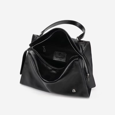 Leather black tote bag with silver zipper details, spacious interior, ideal for luxury accessories and daily use. Perfect for fashion-forward individuals seeking stylish storage solutions.