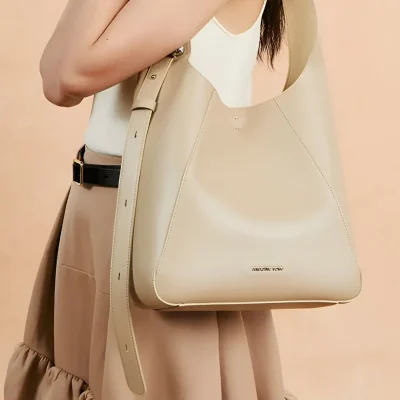 Elegant beige leather tote bag showcasing stylish design, perfect for women seeking luxury accessories from Monalisa Store, ideal for chic everyday or professional use.