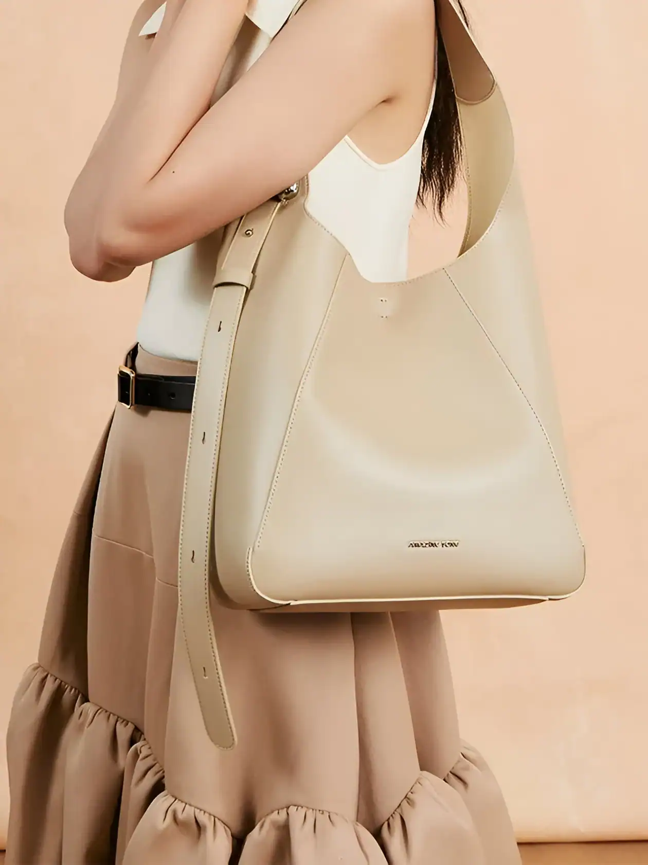 Elegant beige leather tote bag showcasing stylish design, perfect for women seeking luxury accessories from Monalisa Store, ideal for chic everyday or professional use.