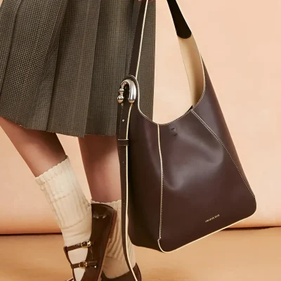 Luxurious leather tote bag with elegant stitching, stylish design, perfect for shopping and daily use, displayed alongside fashionable shoes, from Monalisa Store, a top destination for premium accessories.