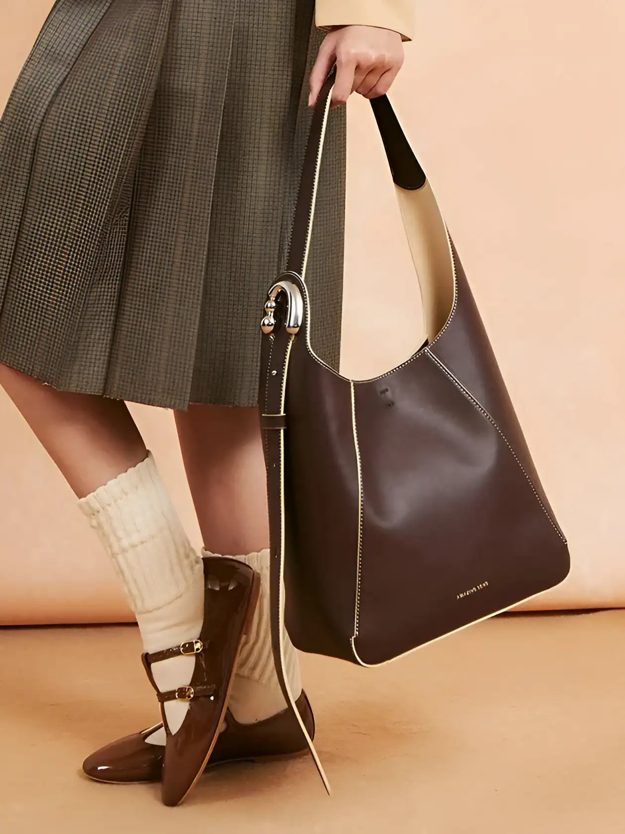 Luxurious leather tote bag with elegant stitching, stylish design, perfect for shopping and daily use, displayed alongside fashionable shoes, from Monalisa Store, a top destination for premium accessories.