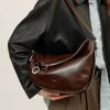 Leather shoulder bag with zipper detail, stylish accessory for women, perfect for everyday use and fashion-forward outfits.