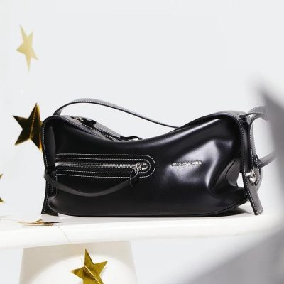 Elegant black leather designer handbag with silver zippers, perfect for luxury fashion and style, showcasing Monalisa Medical Store's exclusive collection of trendy accessories.