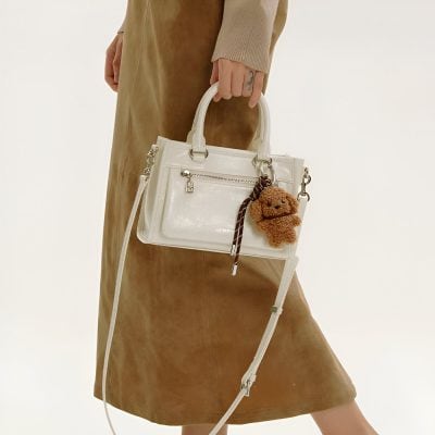 White handbag with plush bear keychain, casual accessory for women, Monalisa Store, stylish and functional fashion item.