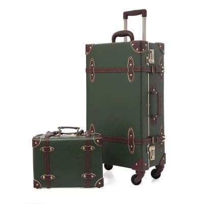Premium vintage green leather luggage set with brown accents, perfect for travel and business trips. Stylish, durable, and designed for easy mobility with spinning wheels and secure locks.