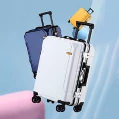 Lightweight hard-shell travel suitcases with four spinner wheels, available in white, navy blue, and yellow, designed for durable and stylish travel storage.