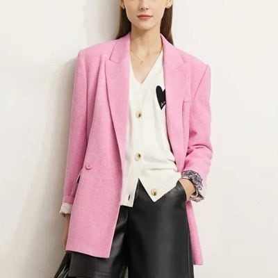 Pink women's oversized wool coat showcased at Monalisa Store, perfect for fall and winter fashion. Stylish, warm, and chic outerwear for a sophisticated look.
