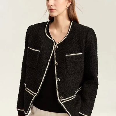 Black textured blazer with white piping, chic and professional for women.