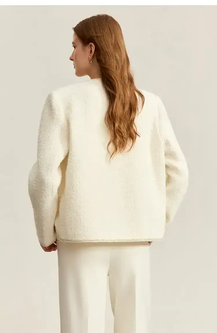 Elegant white textured knit sweater with a classic fit, paired with matching trousers, perfect for sophisticated office or casual wear, available at Monalisa Store.