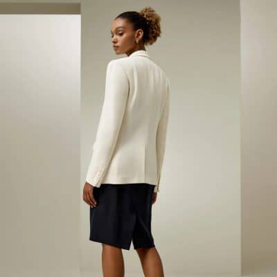 Elegant women's white tailored blazer displayed at Monalisa Store, perfect for sophisticated office looks and formal occasions. Shop stylish blazers at Monalisa Medical for a polished appearance.