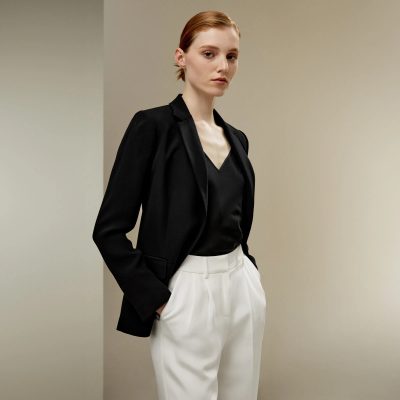 Elegant woman in black blazer and white trousers, professional attire, fashion style, modern outfit, monochrome look, business casual, minimalist fashion, sophisticated clothing, stylish appearance, Monalisa Store SEO focus.