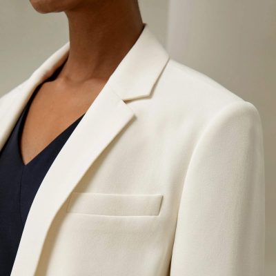 Elegant white blazer and black top, stylish formal wear for professional or special occasions, perfect for men and women seeking high-quality fashion options from Monalisa Medical.
