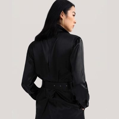 Elegant black satin dress with tailored fit, long sleeves, and stylish waistband, perfect for sophisticated occasions at the Monalisa Medical Store.